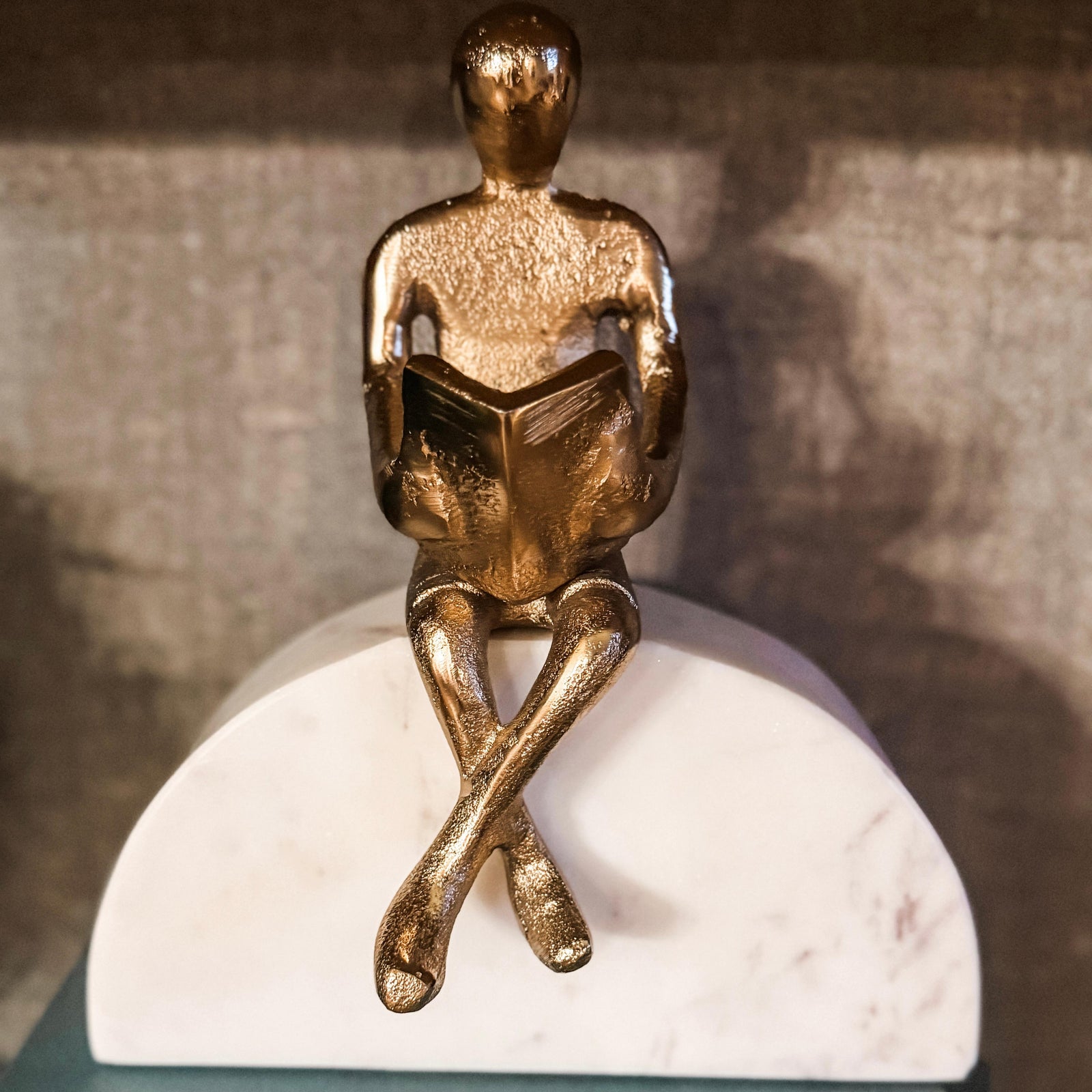 Gold Reader on Marble