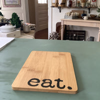 “Eat” bamboo cheese boards